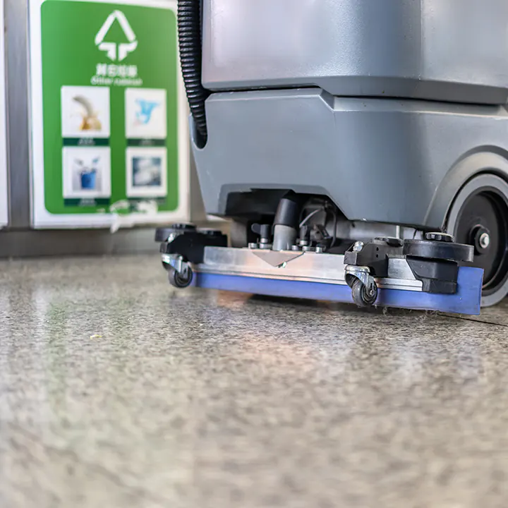 A Janitor buffing a commercial floor